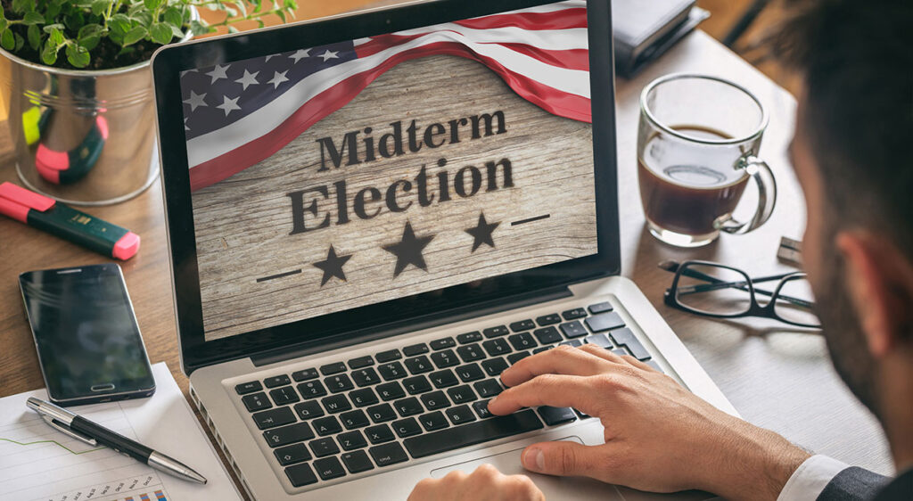 man on computer for midterm elections