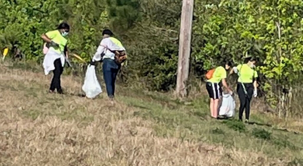 Volunteers cleaning up trash from illegal dumping in Polk County 